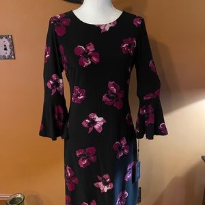 Brand new with tags Tommy Hilfiger dress with bell sleeves. Size 4!